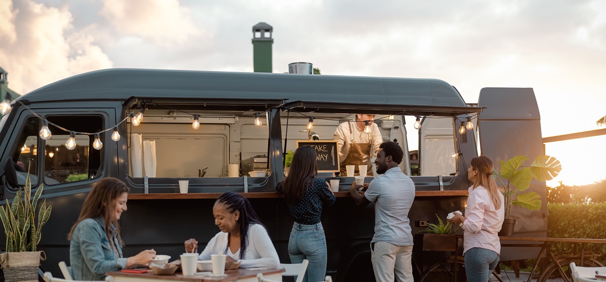 modern food truck serving patrons in an agricultural area