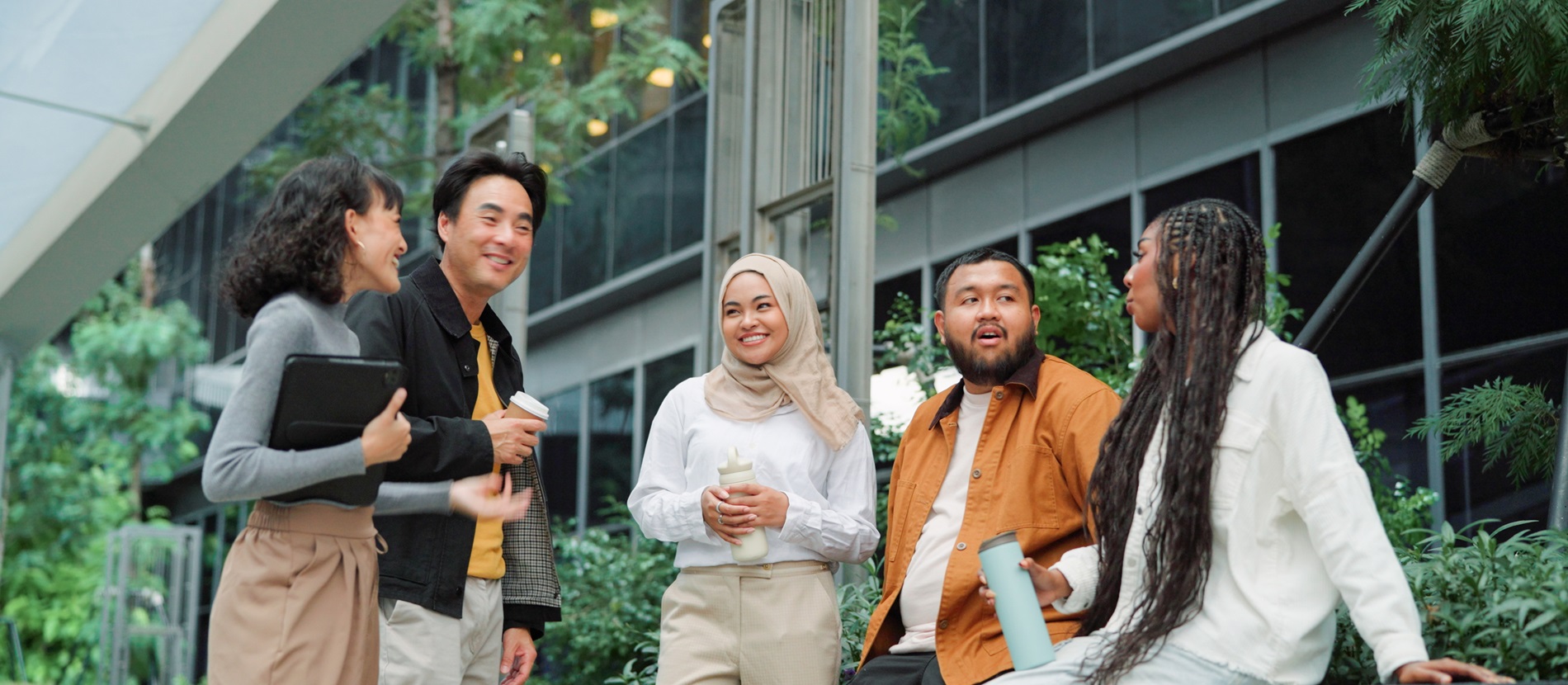 diverse group of people talking outdoors