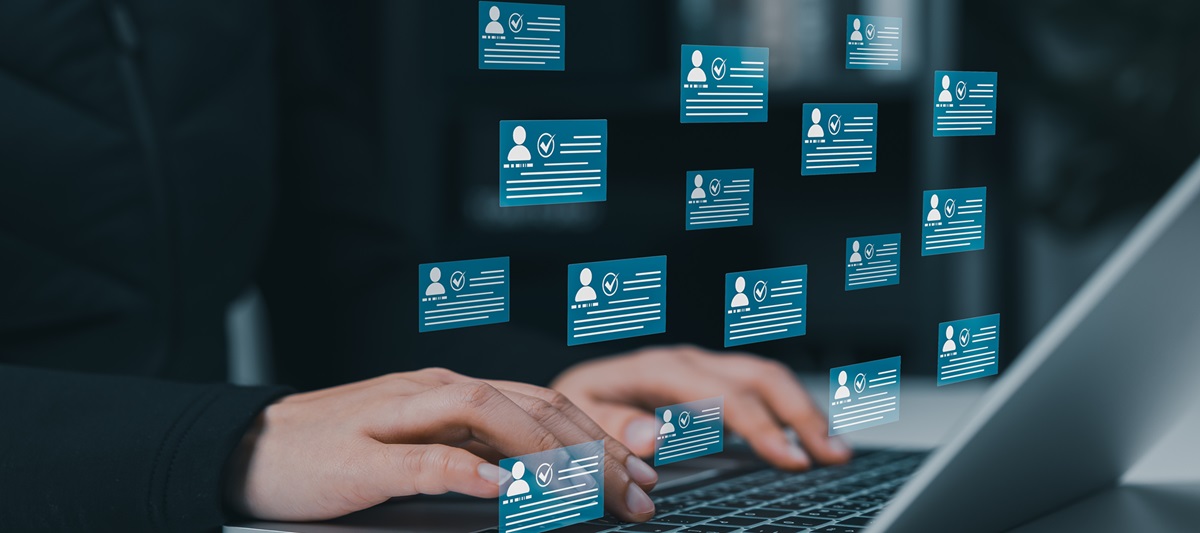 hands using laptop keyboard with pop-up message graphics 