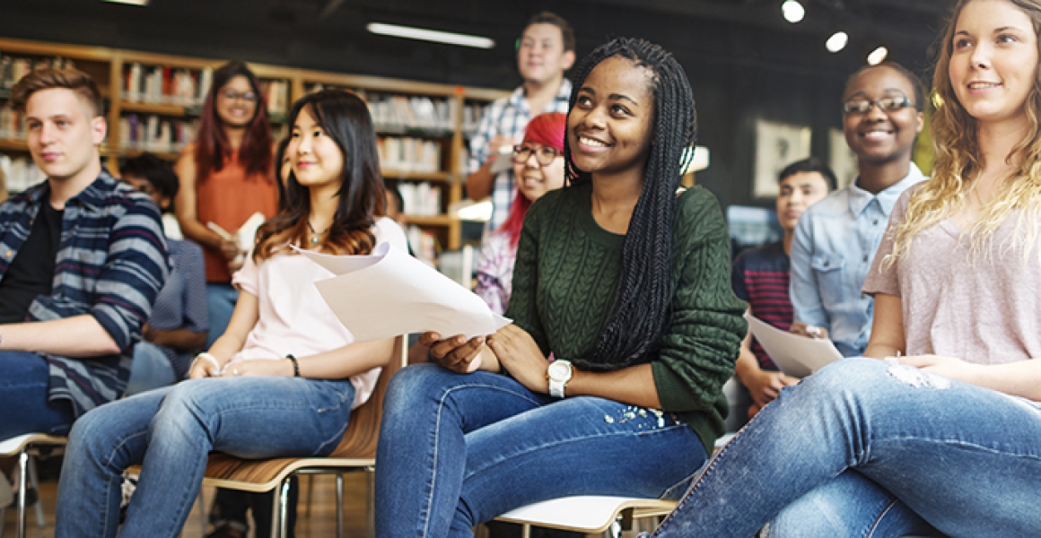 students sitting down in the library