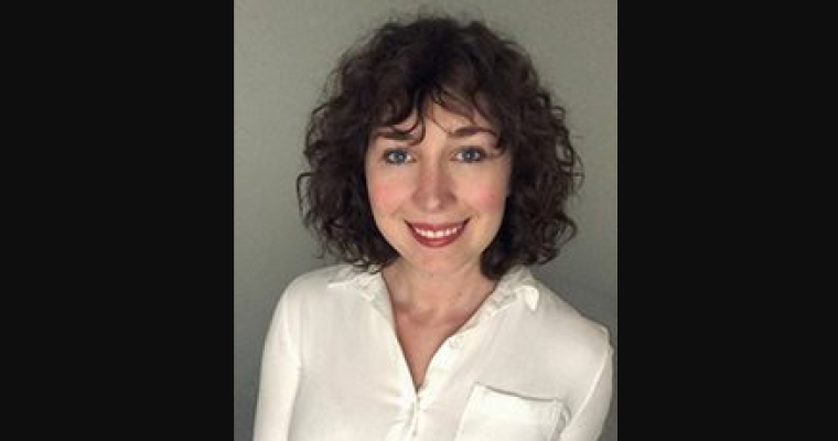 headshot of Adrianne