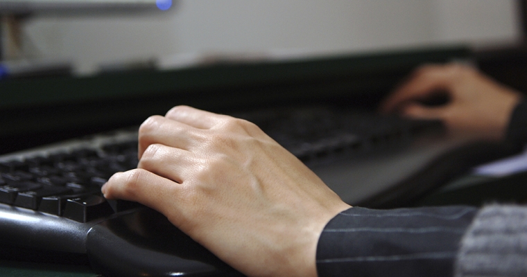 hands typing on keyboard 