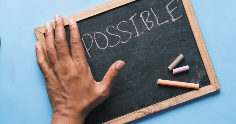 the word "possible" on a blackboard