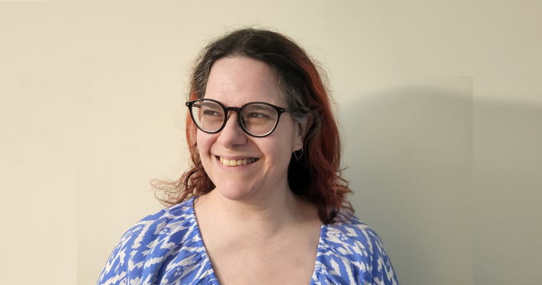 Alexandra, a woman with dark hair and glasses.