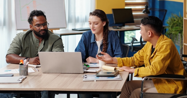 Diverse team talking at meeting