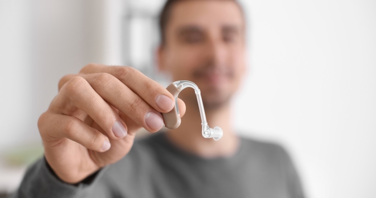Young man with hearing aid