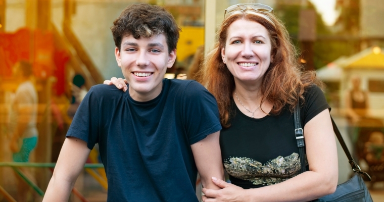 smiling mother and teenage son