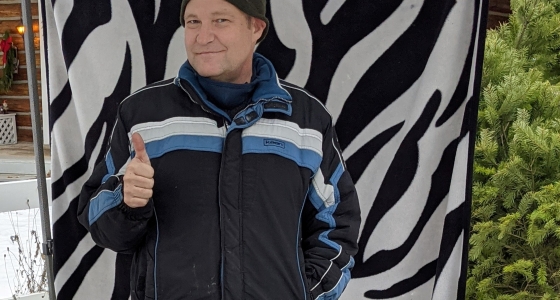 Bradly smiles while showing his new work creations.