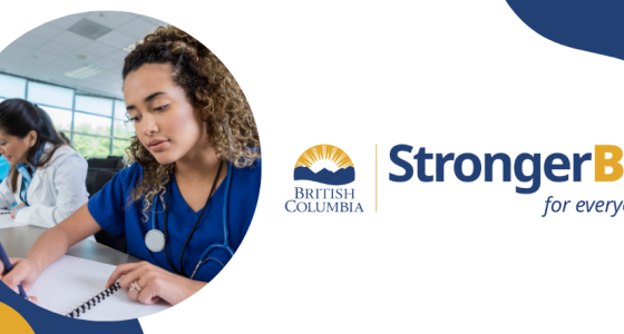 A female nurse in blue scrubs studying. To her right is the StrongerBC logo with a blue and yellow colour pattern.