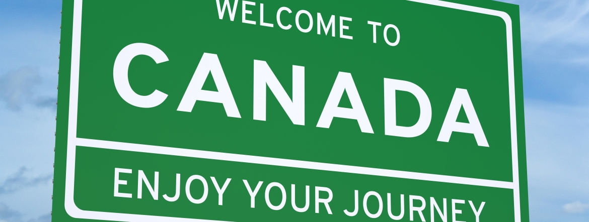 Big green Welcome to Canada sign.