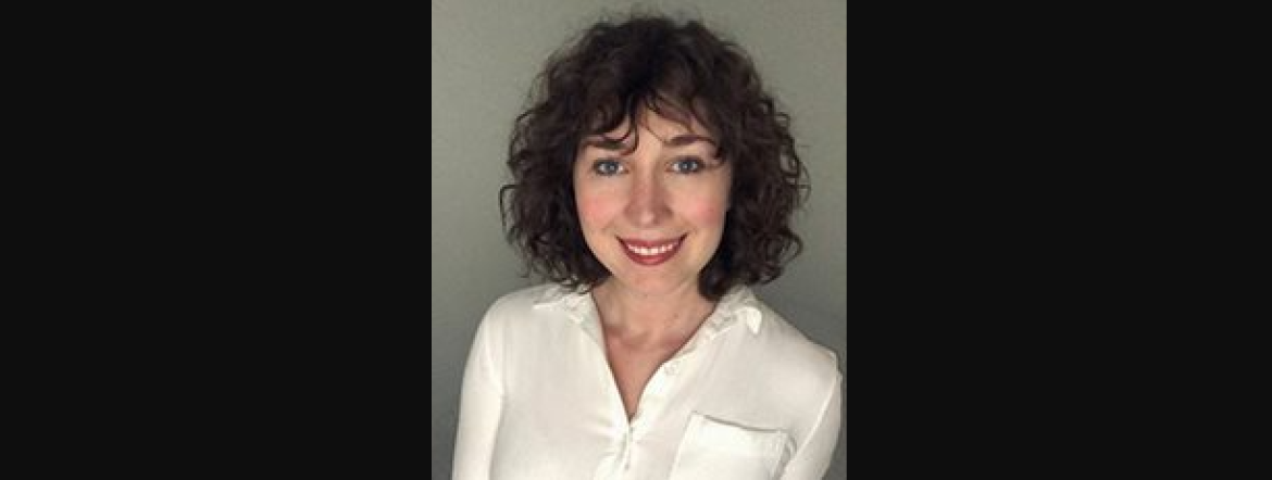 headshot of Adrianne