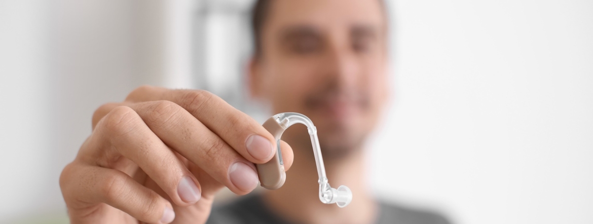 Young man with hearing aid