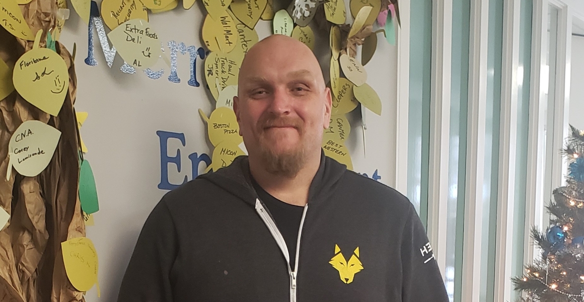 Steven smiles at camera happy to have found a new job with help of WorkBC.