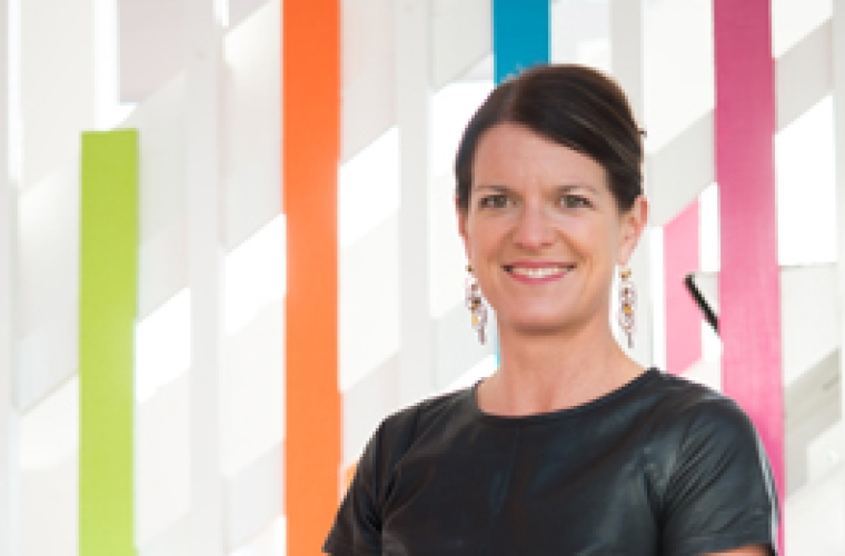 portrait of Mandy standing on hotel stairs