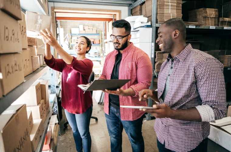 diverse group of employees reviewing business inventory