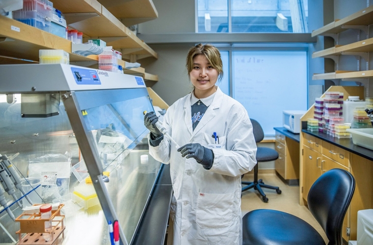 female scientist wearing white lab coat