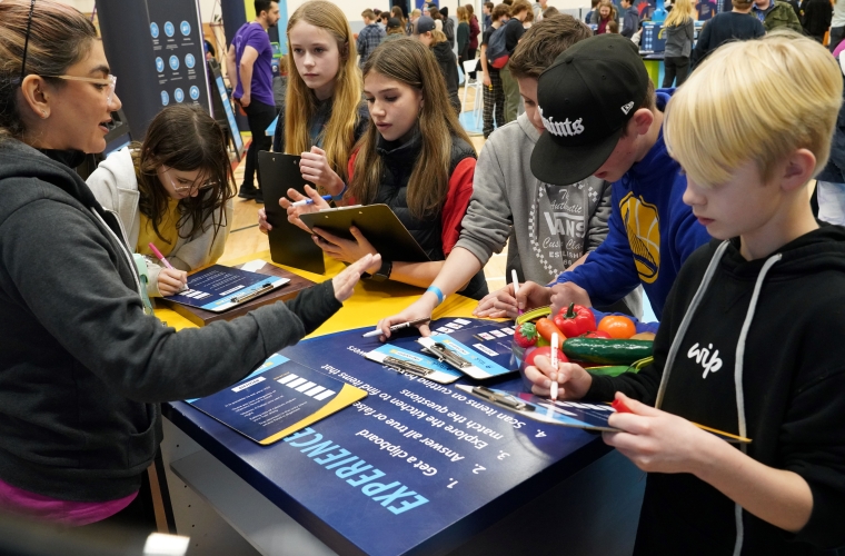 group of students at a career activity station at Find Your Fit event