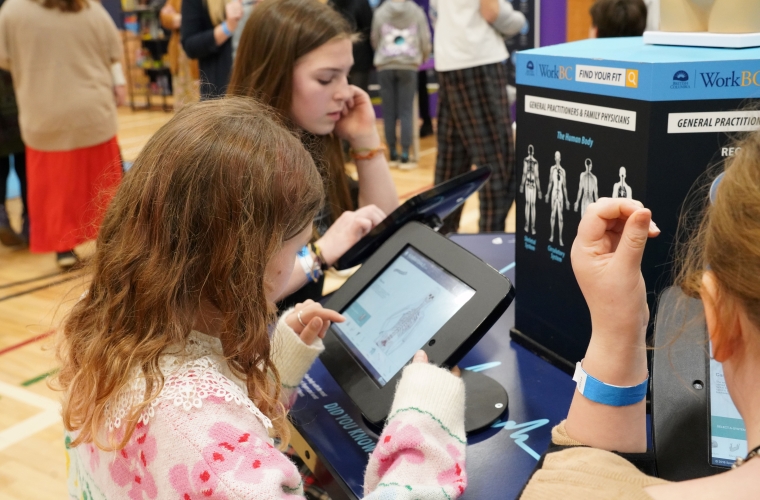 students at a career activity station at a Find Your Fit event