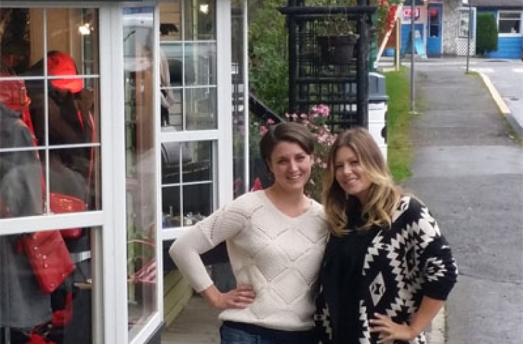 Denise and Kim standing in front of their store