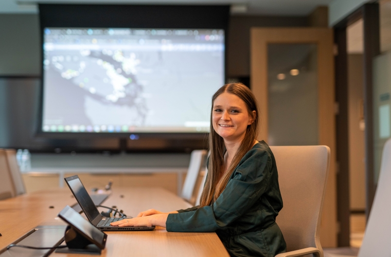 woman with laptop in boardroom
