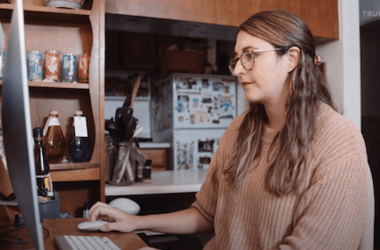 Sarah sitting in front of computer