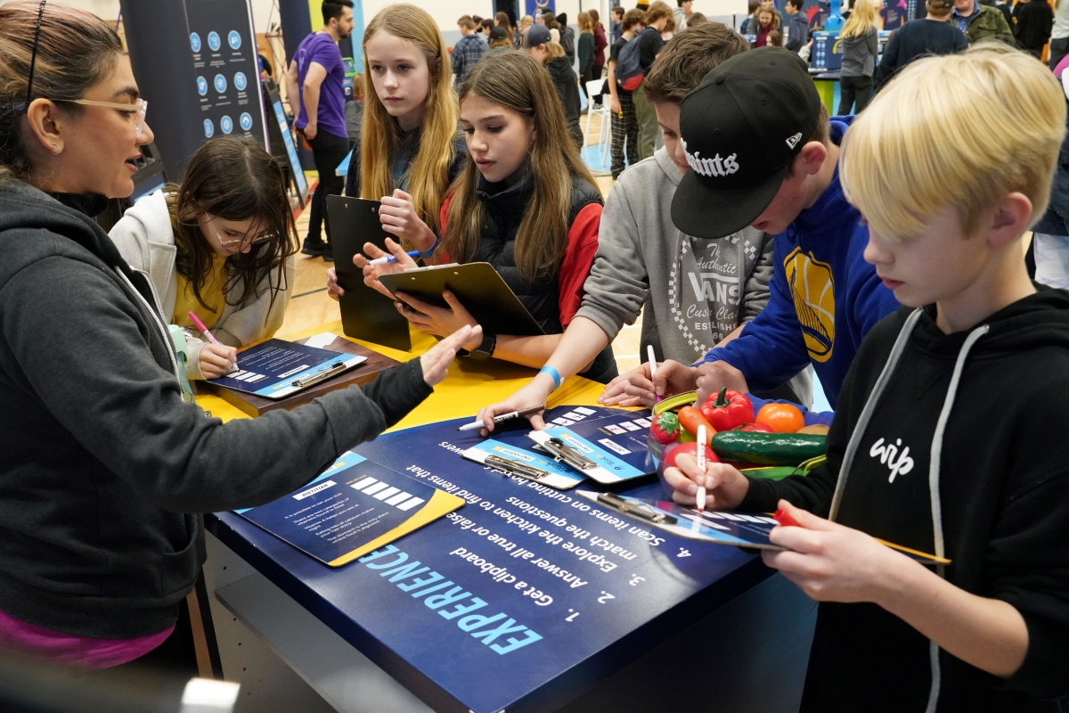 group of students at a career activity station at Find Your Fit event