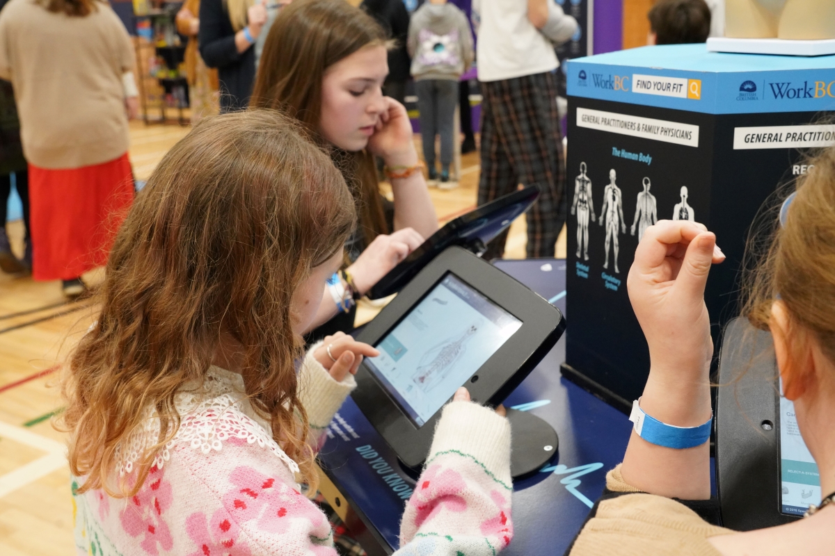 students at a career activity station at a Find Your Fit event