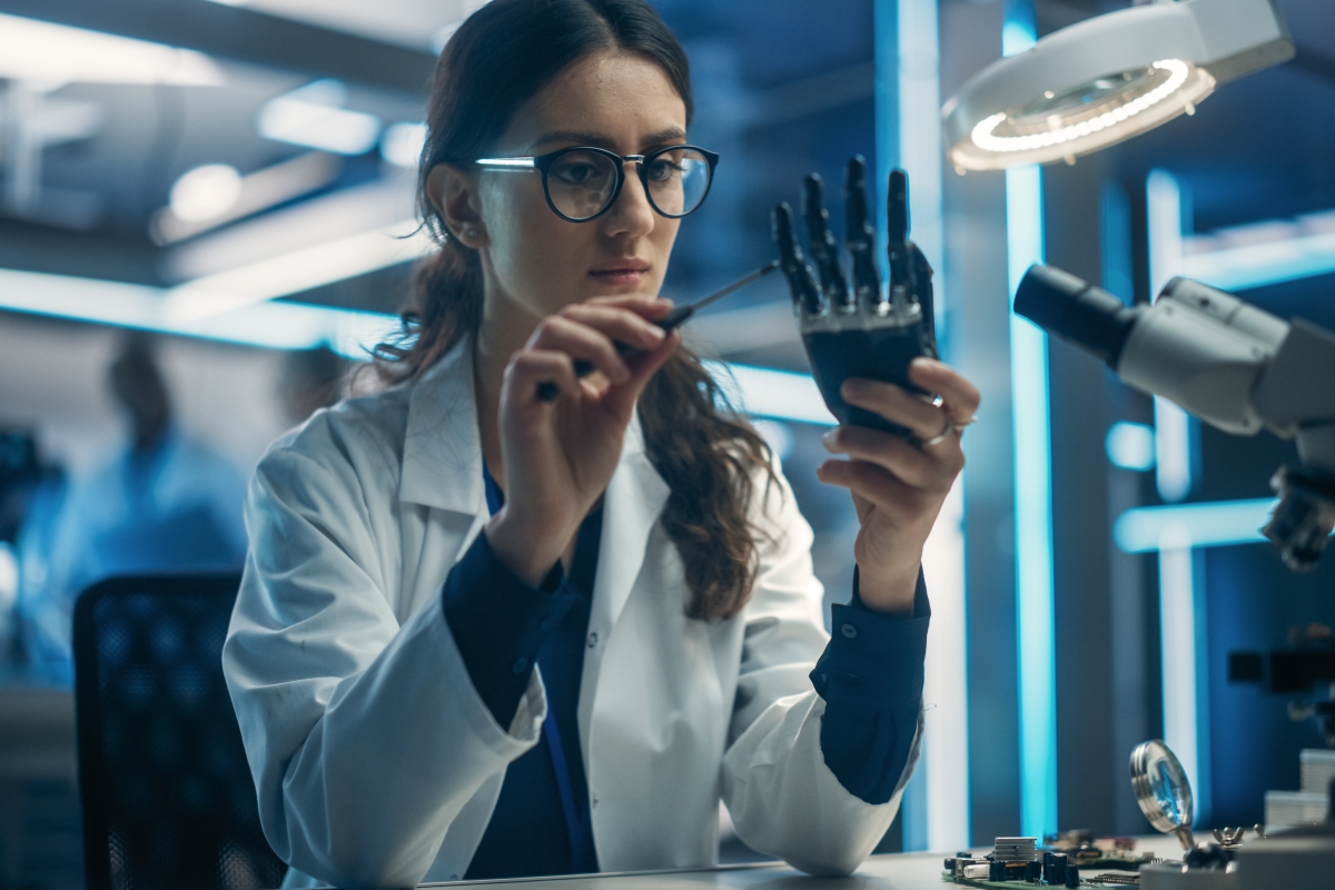young female engineer developing an assisted device