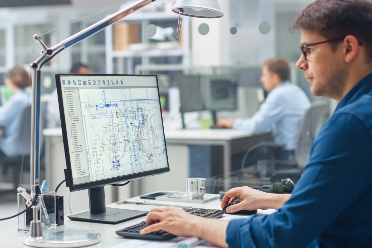 male architecture technologist working on structure designs on a computer