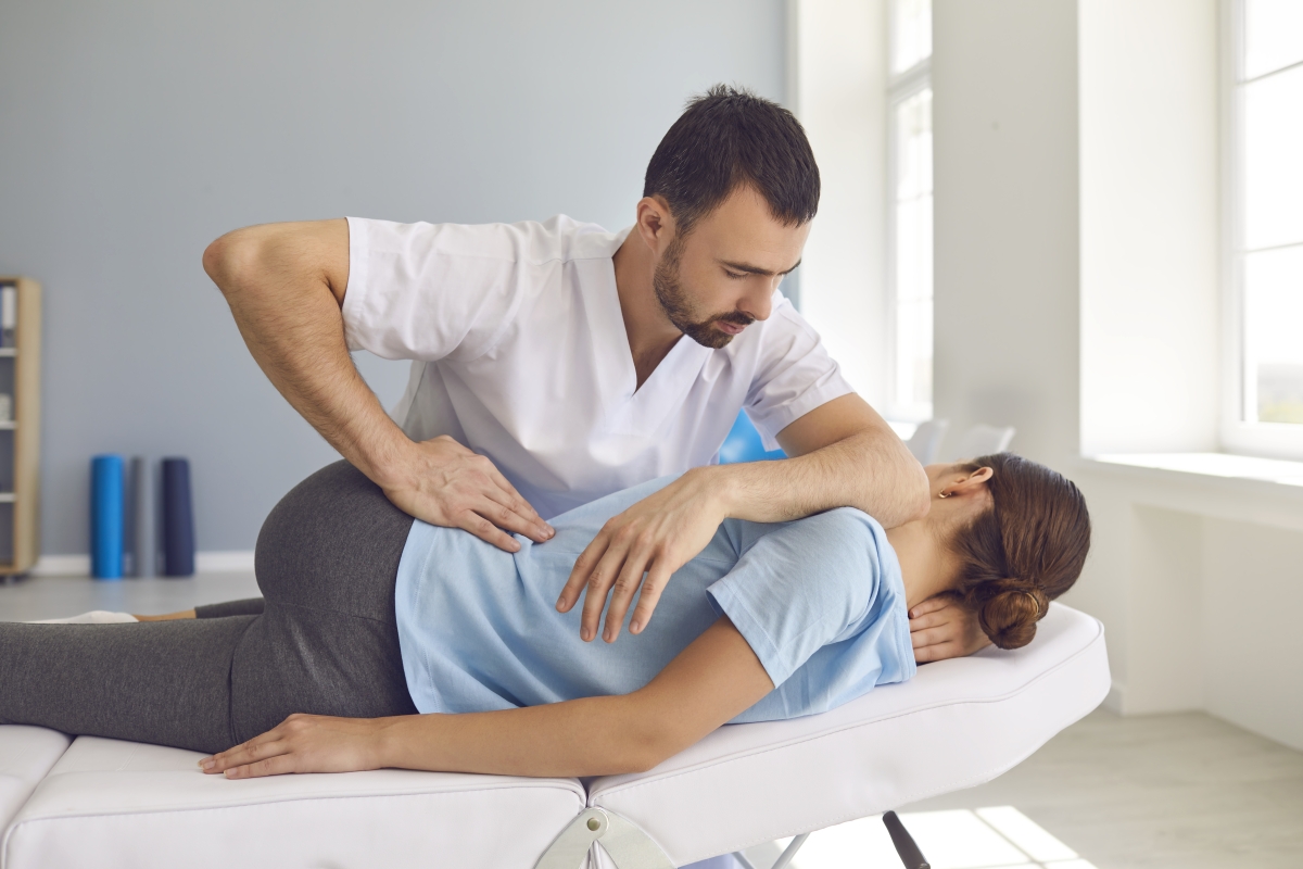 Male chiropractor working on a patient