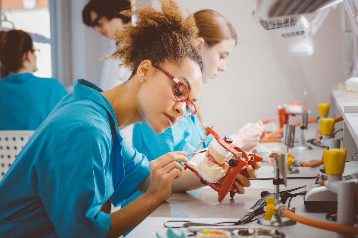 Afro american female making dentures