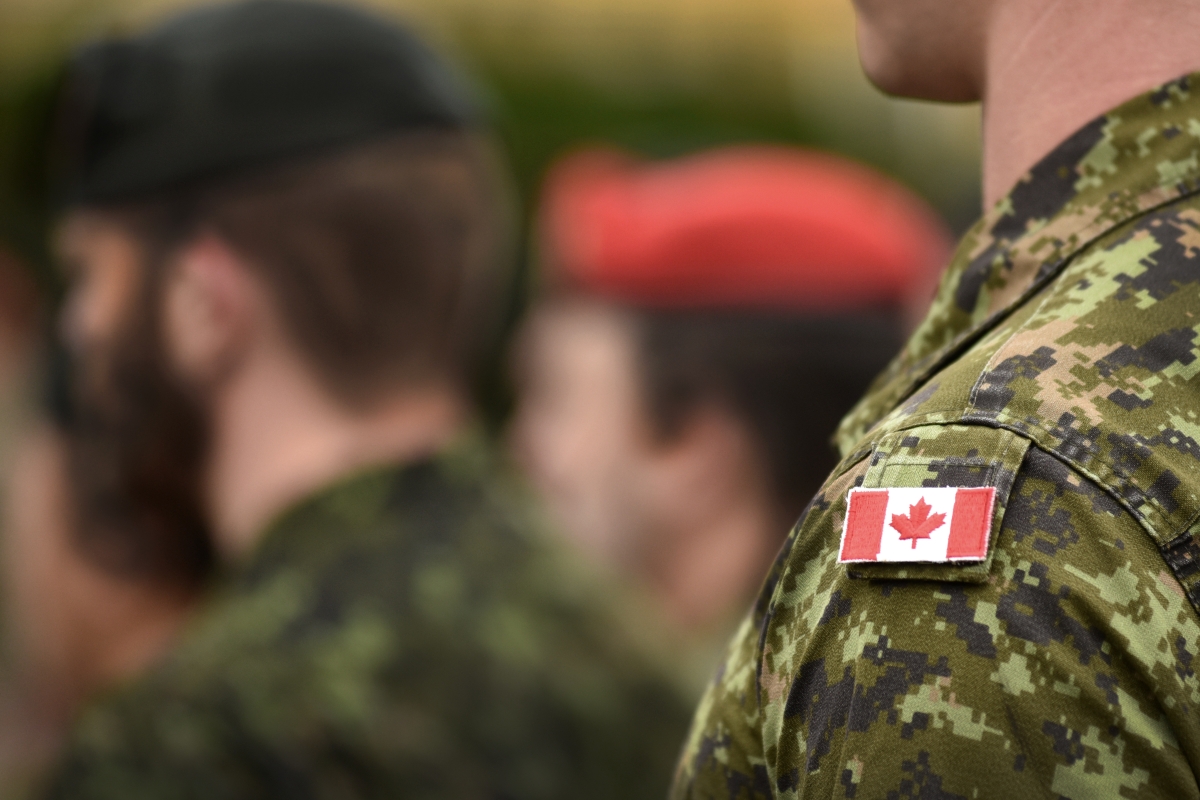 Flag of Canada on the military uniform.
