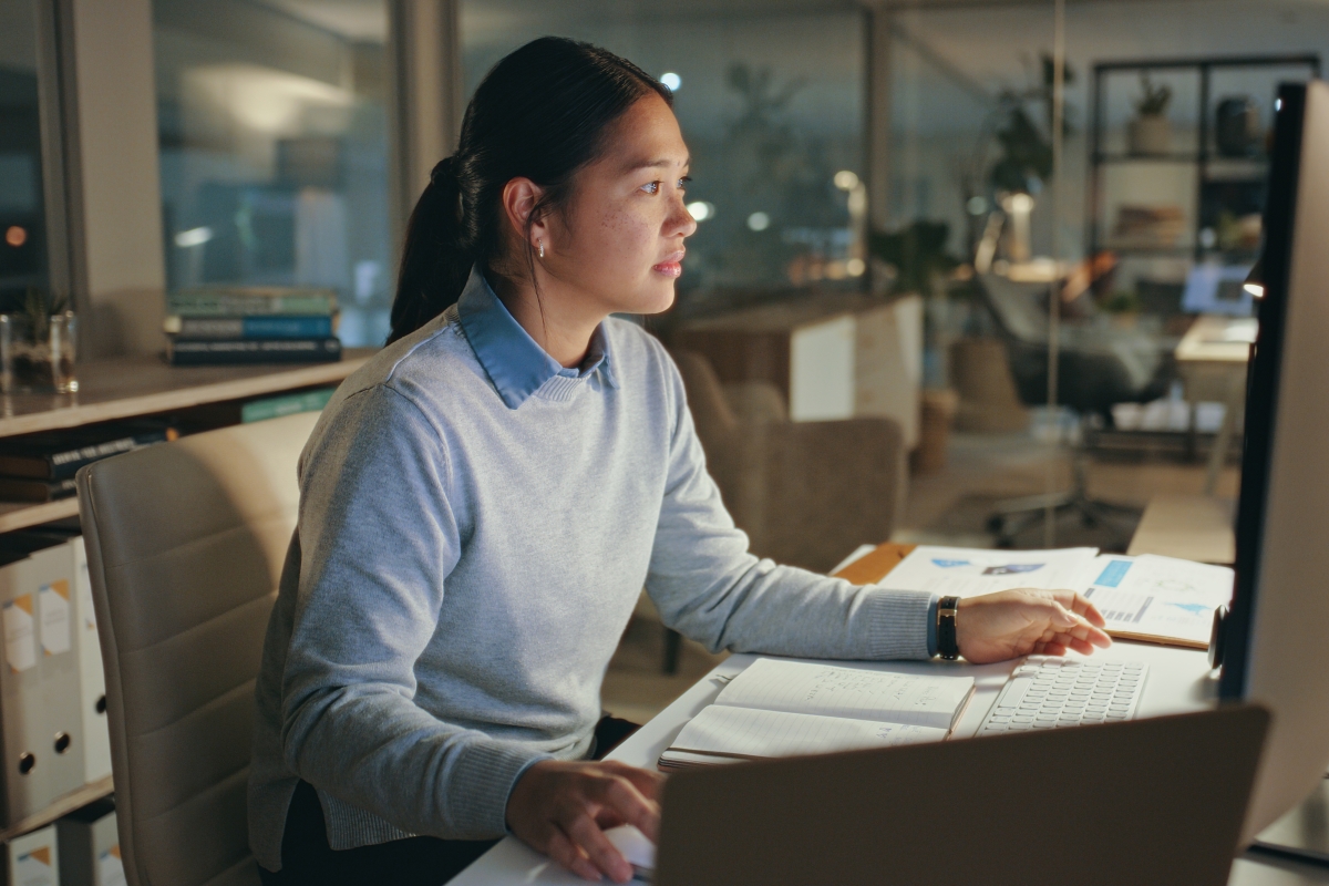 Young Asian woman working on a computer 