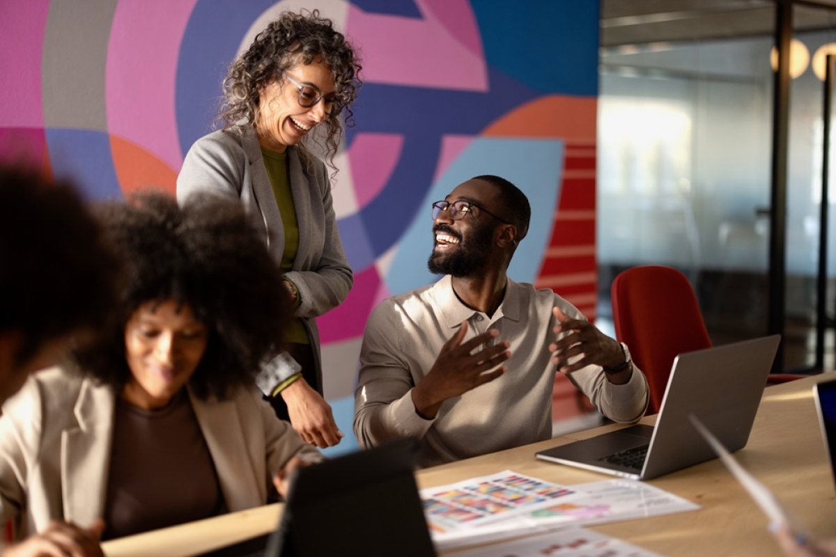 Diverse team of marketing professionals discussing campaign in office