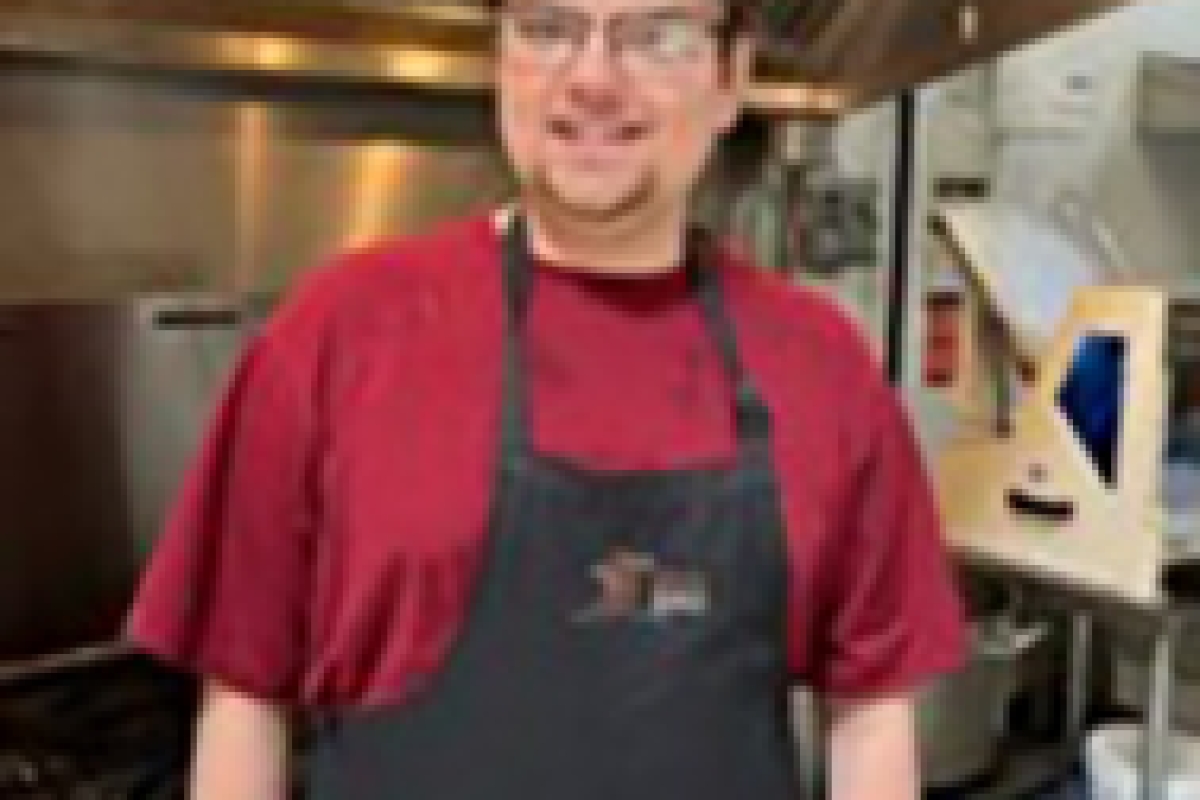 Trenton at work after receiving job support from WorkBC. 