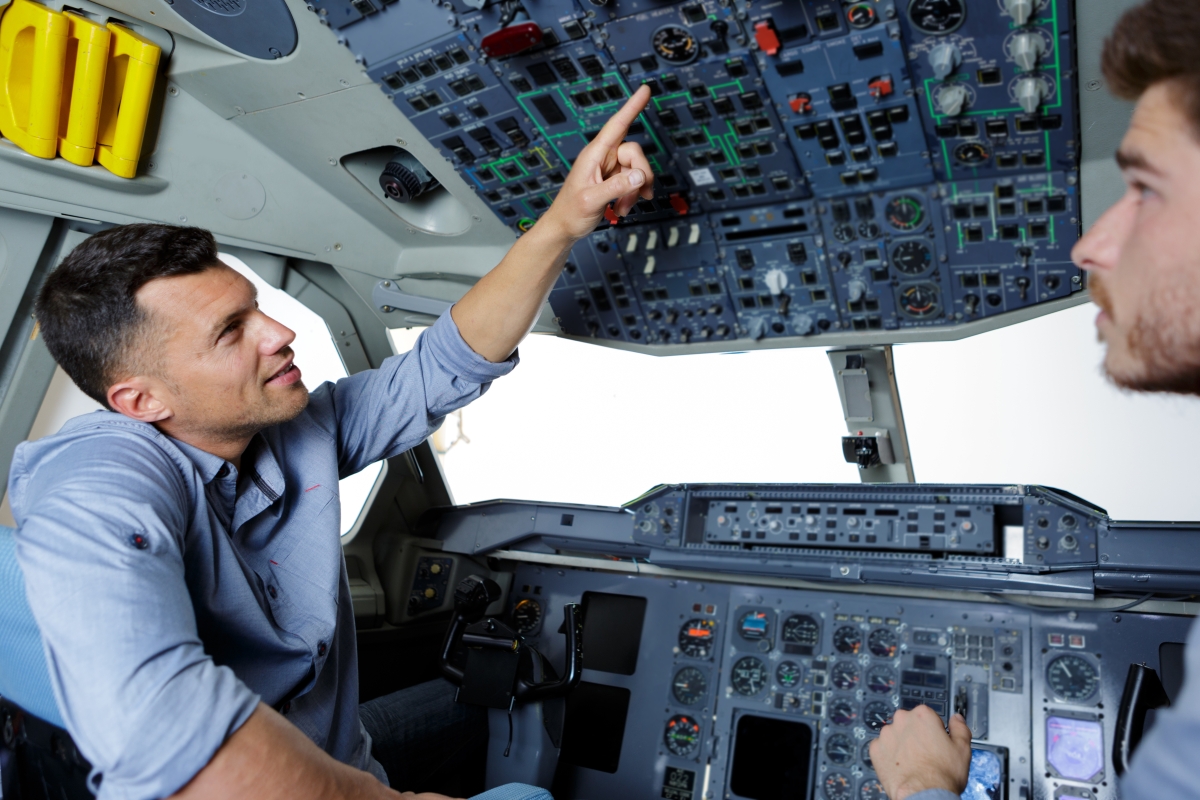 pilots in the cockpit of a plane