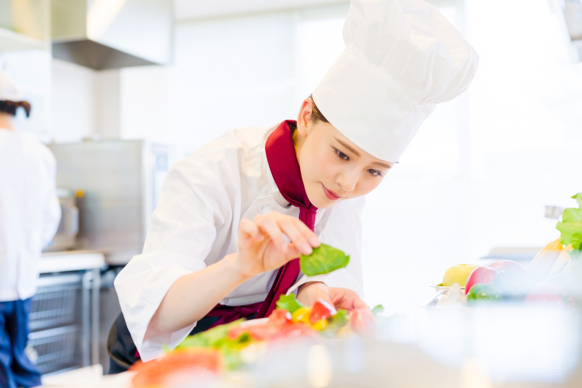chef preparing a meal in a kitchen