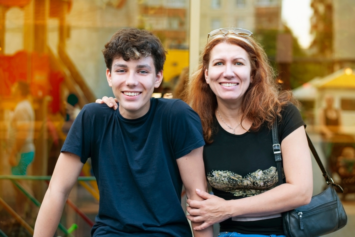 smiling mother and teenage son