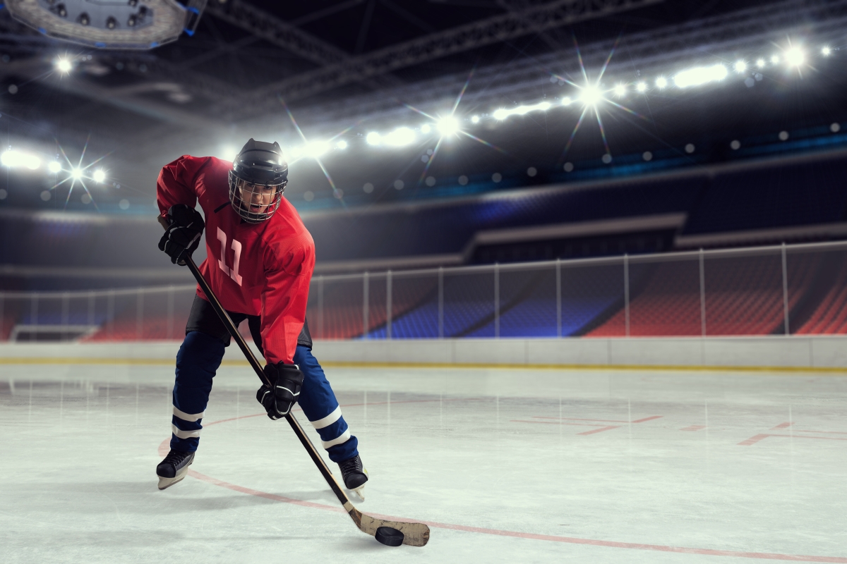 person playing ice hockey in an ice rink