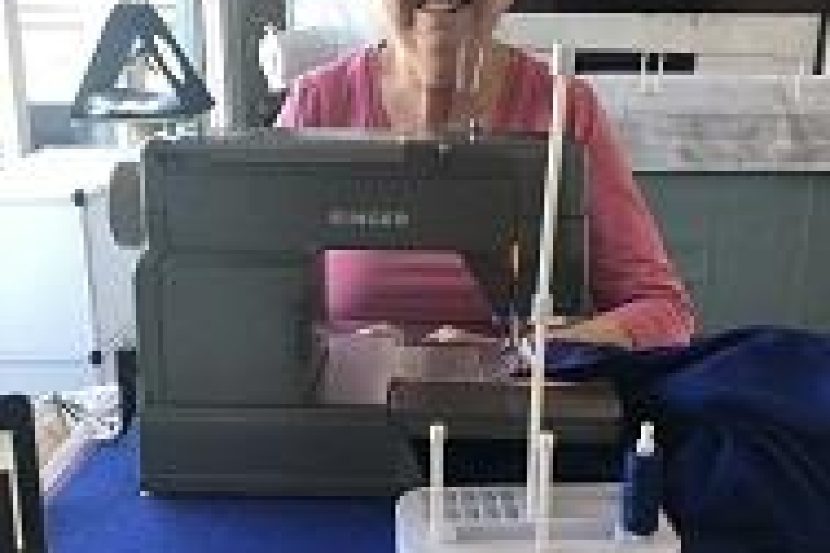Lisa at work using a sewing machine. 