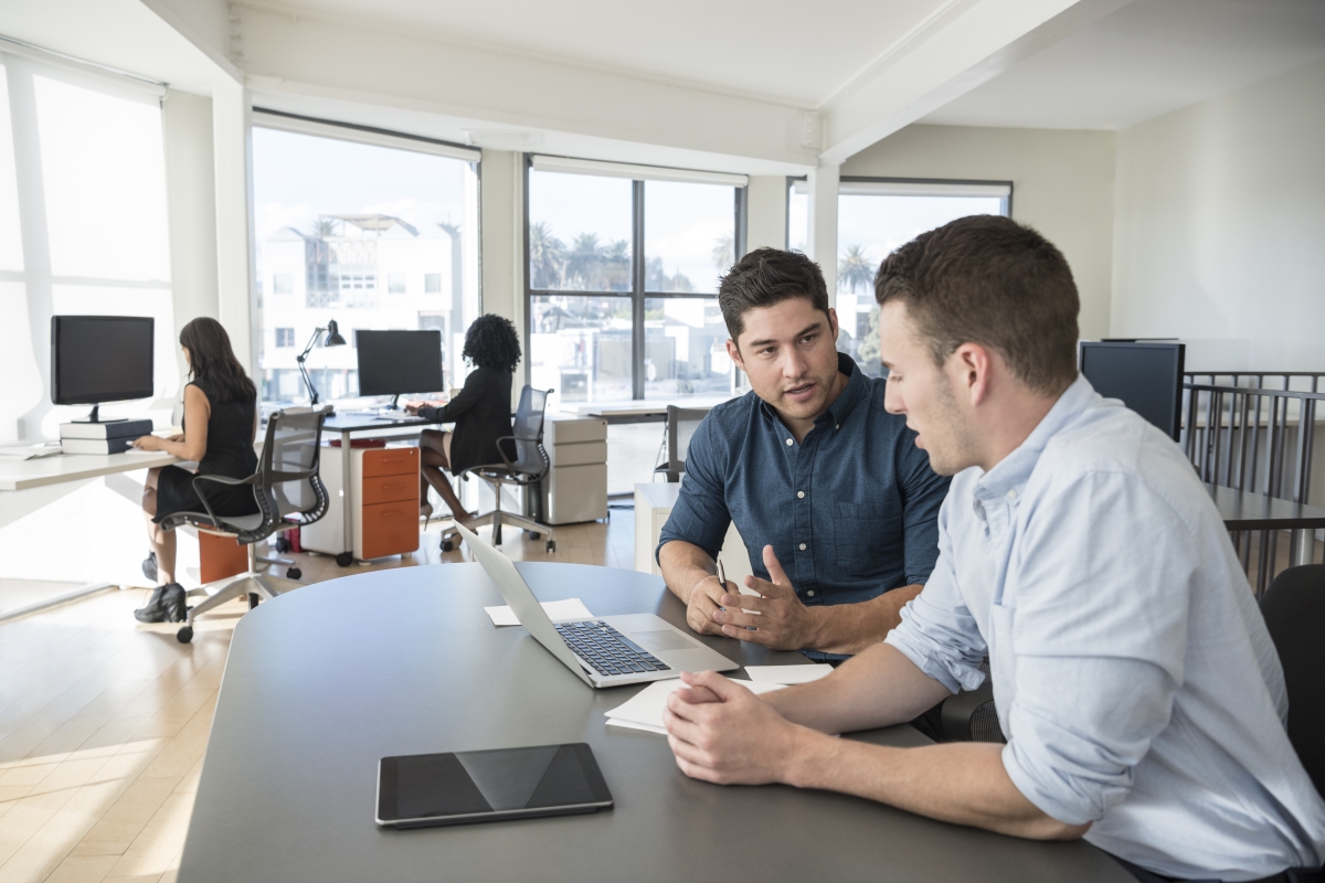 man discussing closer office landscape