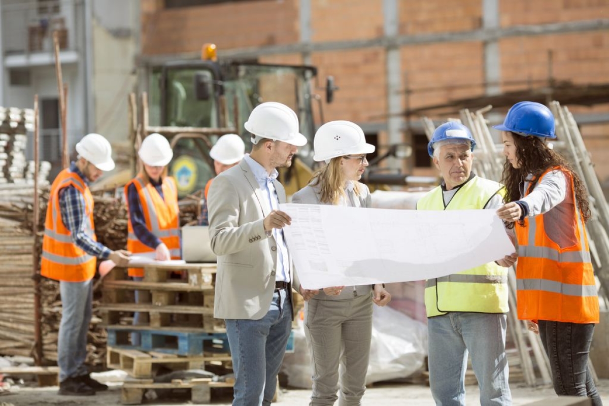 construction workers reviewing plans