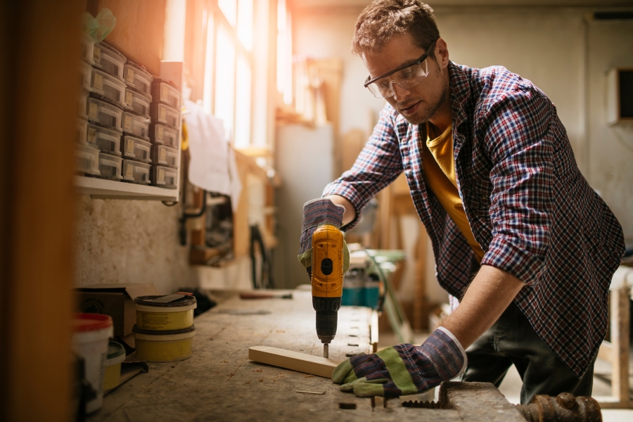 male carpenter working and wearing safety gear