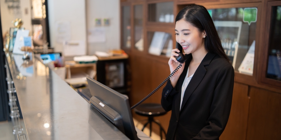 Female receptionist answering phone
