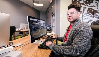 Indigenous man using a computer